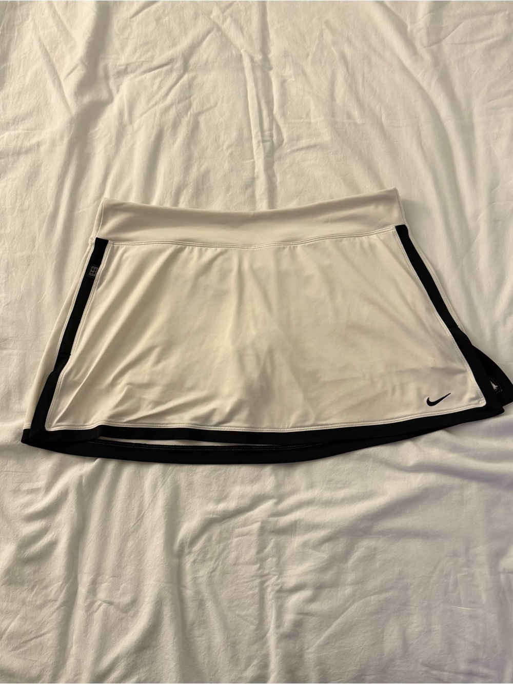 Women's Nike white tennis skirt with black trim. Size L